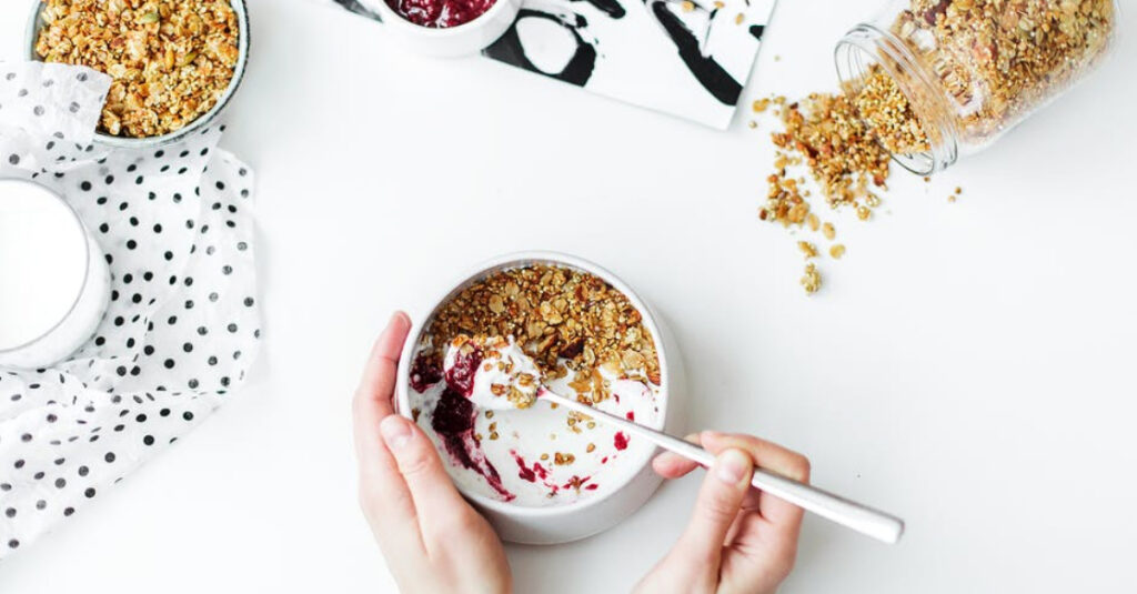 bowl of yogurt with granola and fresh fruit